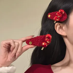 Red Tanghulu flocked hair clips with traditional Chinese coin design detail view.