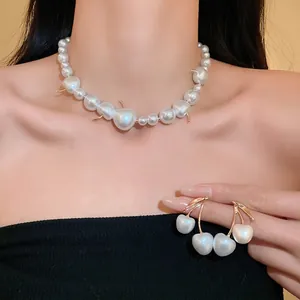 Elegant cream white cherry-shaped pearl necklace and earrings set for stylish women