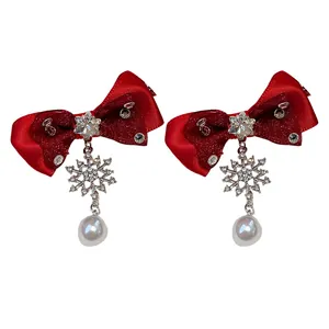 Elegant red bow earrings with sparkling snowflake charms and white pearl dangles for women