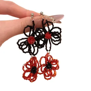 Exquisite handmade red and black beaded flower drop earrings with a vintage artistic design