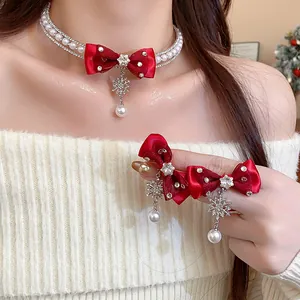 Elegant red bow necklace and matching hair clip set with snowflake and pearl charms