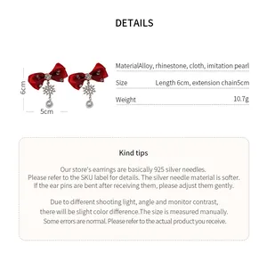 Detail view of red bow earrings with material, weight, and size specifications.