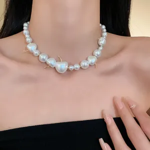 Close-up detail of a French style cherry pearl choker necklace worn by a model