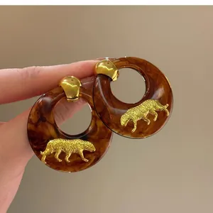 Elegant vintage tortoiseshell resin hoop earrings with gold tiger detail for women