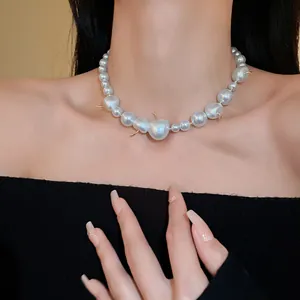Elegant French style pearl necklace with unique cherry-shaped beads and gold details