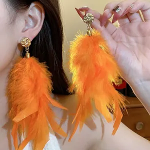 Oversized bright orange feather tassel drop earrings with golden textured stud