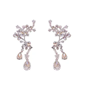 Elegant silver butterfly flower earrings with dangling waterdrop rhinestones for a luxury look.