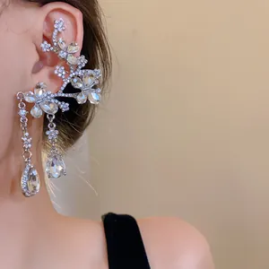 Detail view of exquisite crystal butterfly flower ear cuff with water drop pendants