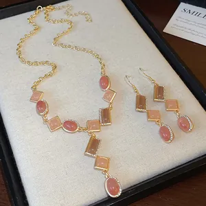 Macro view of vintage geometric rhinestone necklace and earrings jewelry set