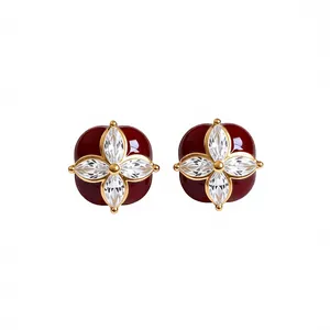 Eleganti orecchini a lobo in smalto rosso con fiore di zircone su perno in argento s925.