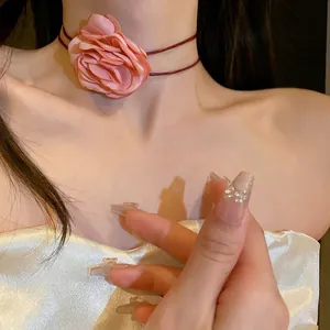 Sweet pink fabric flower choker necklace with double thin cords shown on elegant model