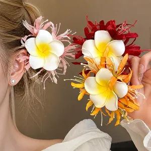 Romantic Plumeria fabric flower hair clips in various colors for vacation beach styles
