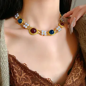 Detail view of vintage palace style choker with faux pearls and red-blue stones
