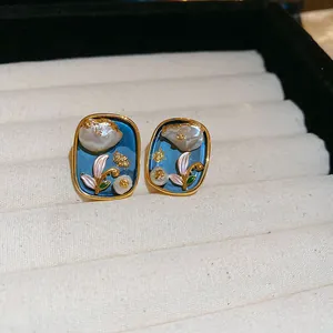 Detailed macro view of French vintage Monet garden style pearl flower stud earrings