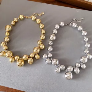 Chunky irregular round beaded necklaces in gold and silver metallic finishes for women