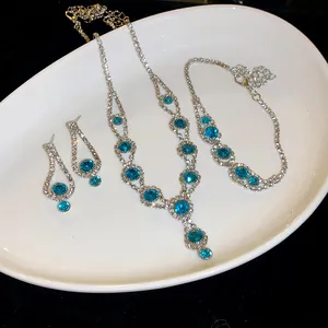 Macro detail of turquoise and rhinestone jewelry set with necklace earrings and bracelet
