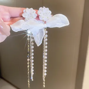 Elegant white flower stud earrings featuring mesh bow and long pearl rhinestone tassels