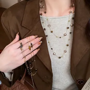 Retro layered long necklace with irregular geometric beads and tiger-eye style stones