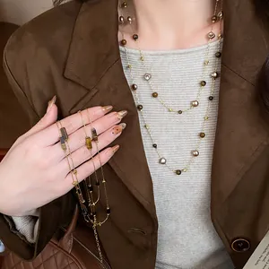 Close-up of vintage layered beaded necklace with irregular geometric brown beads