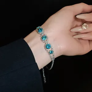 Elegant silver-toned bracelet featuring blue crystals and sparkling clear rhinestones