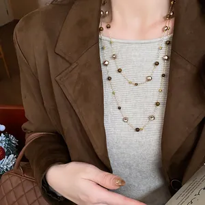 Vintage layered long sweater necklace with irregular beads and gold chain detail