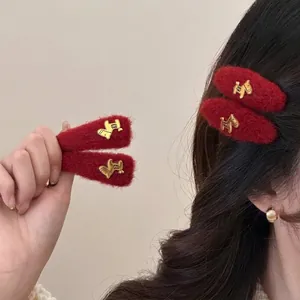 Red flocked hair clips with gold horse emblem, elegant hair accessories for festive fashion