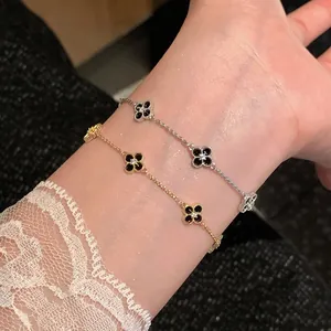 Close-up of elegant zircon flower adjustable bracelets in gold and silver plating
