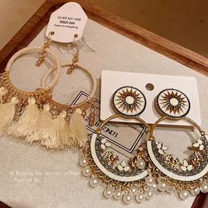 Vintage bohemian ethnic style round hoop earrings with cream tassels and pearl charms