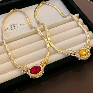 Vintage gold snake chain necklace with oval ruby and topaz crystal pendants