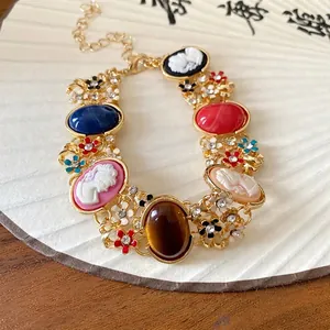 Vintage French style bracelet with colorful flowers, rhinestones, and resin cameos