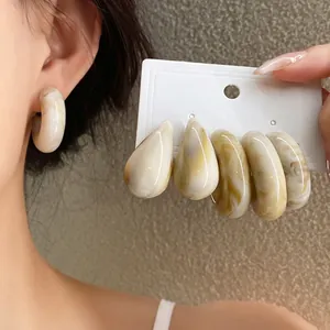 Retro marbled acrylic C-shaped earrings set for women, elegant jewelry accessories.