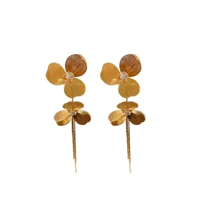 Elegant gold-plated floral tassel drop earrings featuring sparkling crystal accents