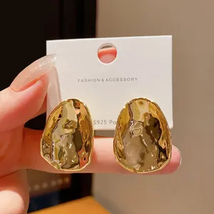 Chic irregular hammered metal stud earrings with gold finish and S925 silver posts