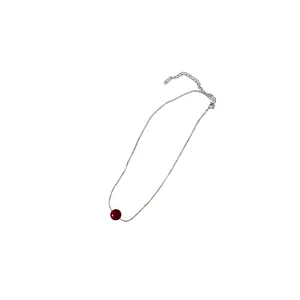 Elegant Ancora red pearl necklace with minimalist silver-tone chain on a white background