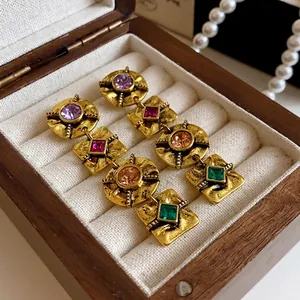 Vintage gold-tone drop earrings with colorful square rhinestones and silver pins