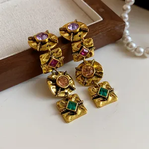 Vintage textured golden dangling earrings with vibrant multi-color geometric crystal accents
