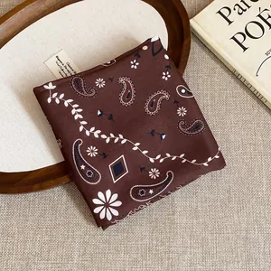 Detailed view of vintage paisley print brown square scarf with elegant floral patterns