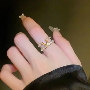 Luxury gold-plated double-layer open ring with zircons and V-shape design motif