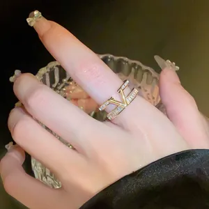 Luxury gold-plated double-layer open ring featuring a zircon-encrusted V design detail