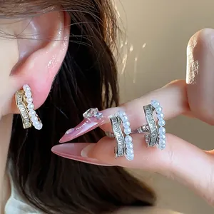Elegant 18k gold plated C-shaped ear clips featuring shiny zircons and white pearls