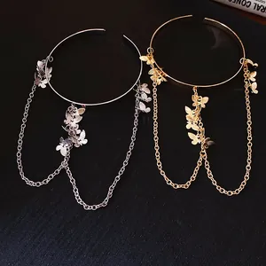 Détails visuels des bracelets de bras à pompons papillon en finition or et argent