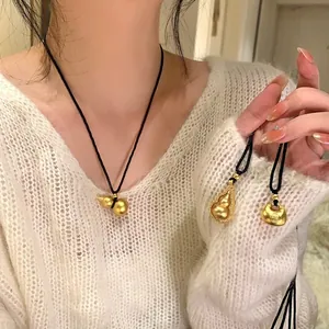 Elegant vintage Chinese style gold gourd pendant necklace with a black woven cord