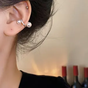 Vintage gold plated zircon pearl ear cuff for non-pierced ears, elegant lifestyle shot
