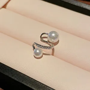 Elegant silver-tone ear cuff with double pearls and sparkling zircons in a pink gift box