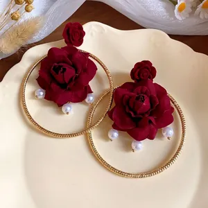 Elegant vintage French style gold hoop earrings with burgundy velvet roses and pearls.