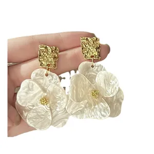 Elegant white pearlescent flower drop earrings with gold textured studs for women