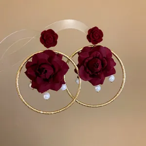 Elegant burgundy fabric rose gold hoop earrings with delicate white pearl accents