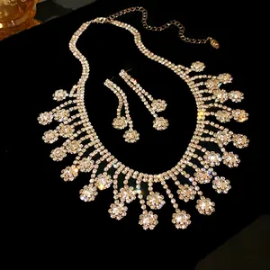 Detailed view of luxury silver rhinestone fringe necklace and earrings jewelry set