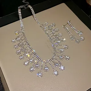 Close-up of a luxurious sparkling rhinestone tassel necklace and earrings jewelry set