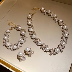 Luxurious vintage pearl and rhinestone jewelry set including necklace and bracelet